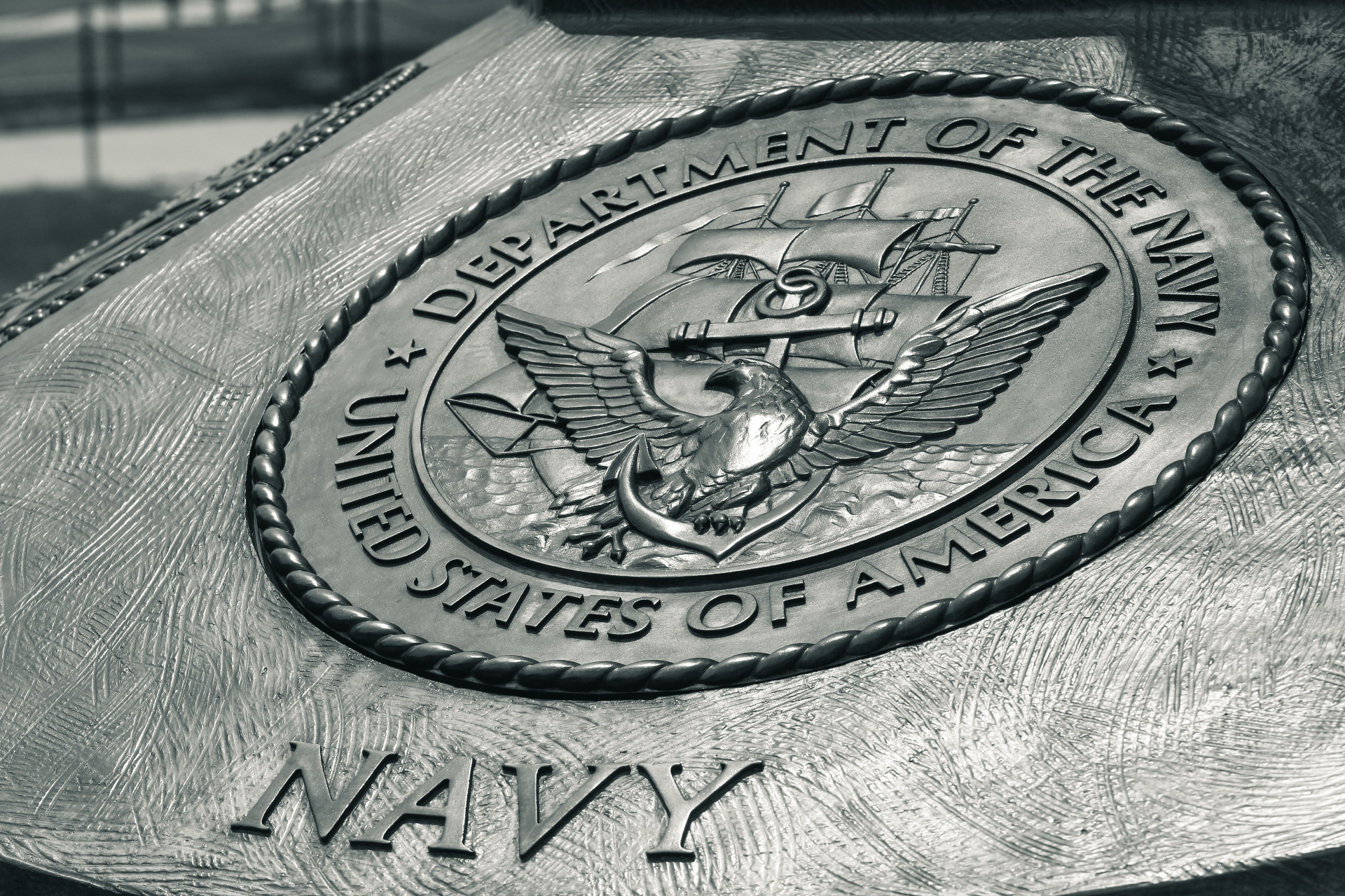United States Navy emblem engraved in metal